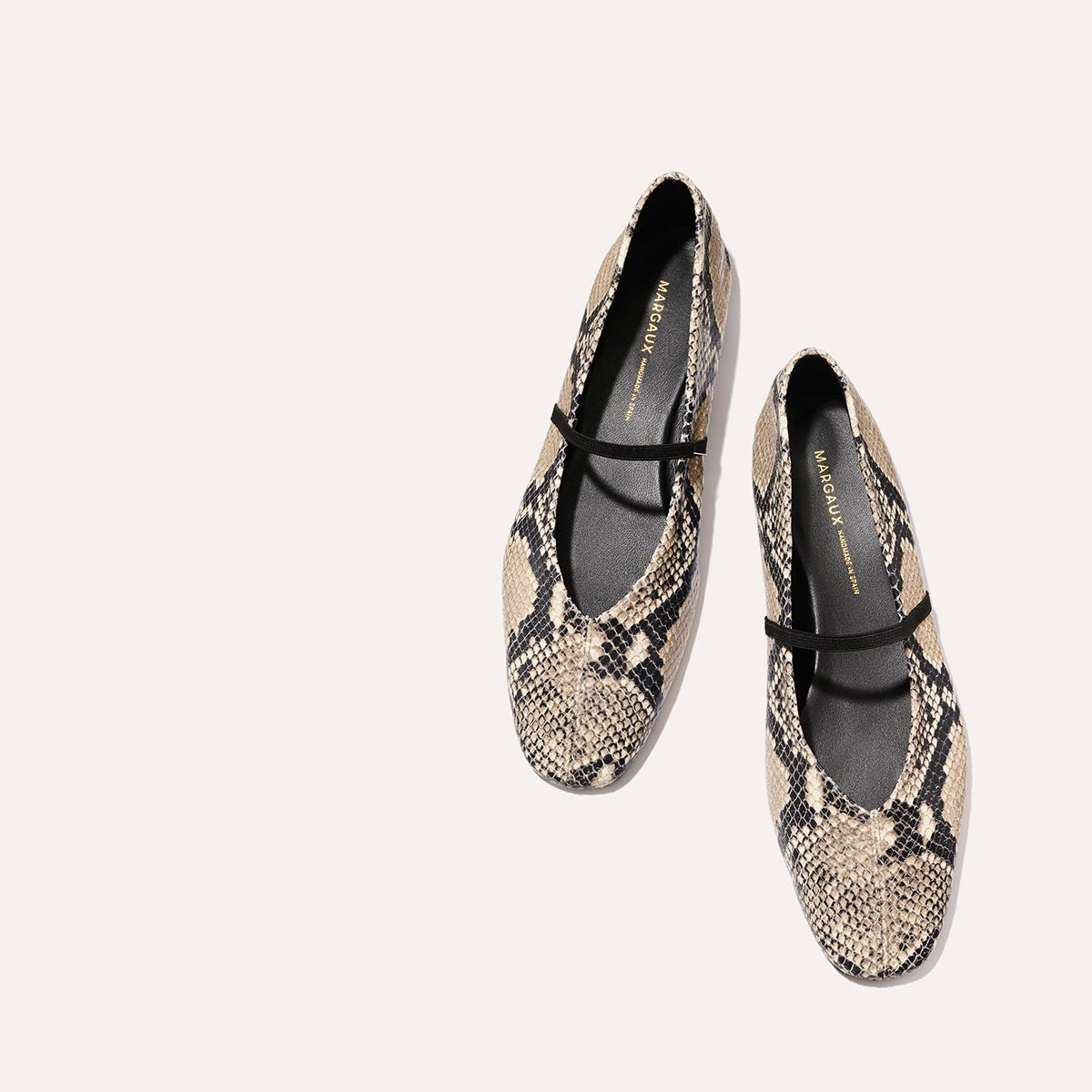 The Phoebe - Natural Python Embossed by margaux-development: womens ballet flats in beige and black python-embossed leather, sacchetto construction for flexibility, with a single black strap, shown on a plain light background.