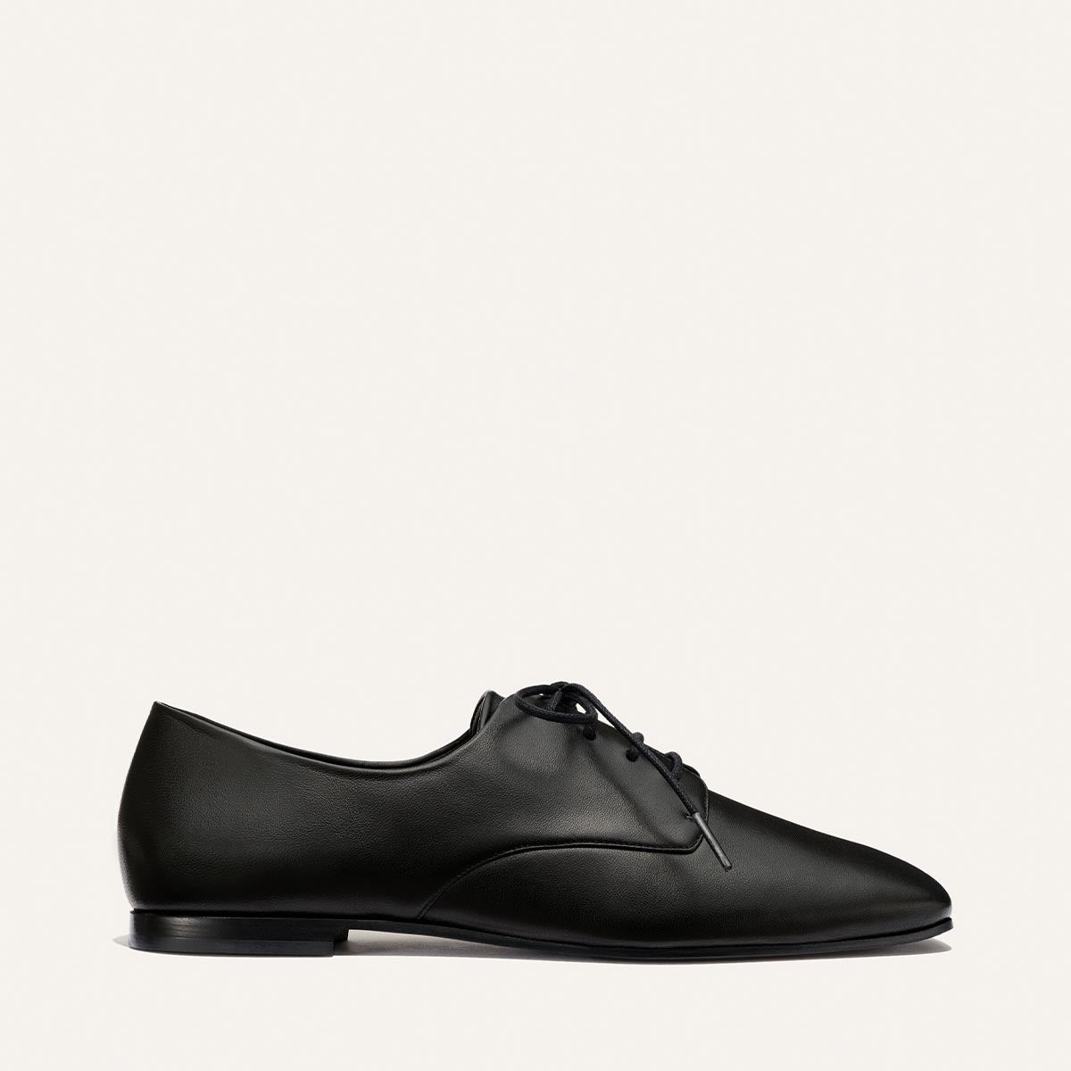 The Billie Derby - Black Nappa by Margaux, a classic black leather lace-up dress shoe, shown in a side view against a plain white background.