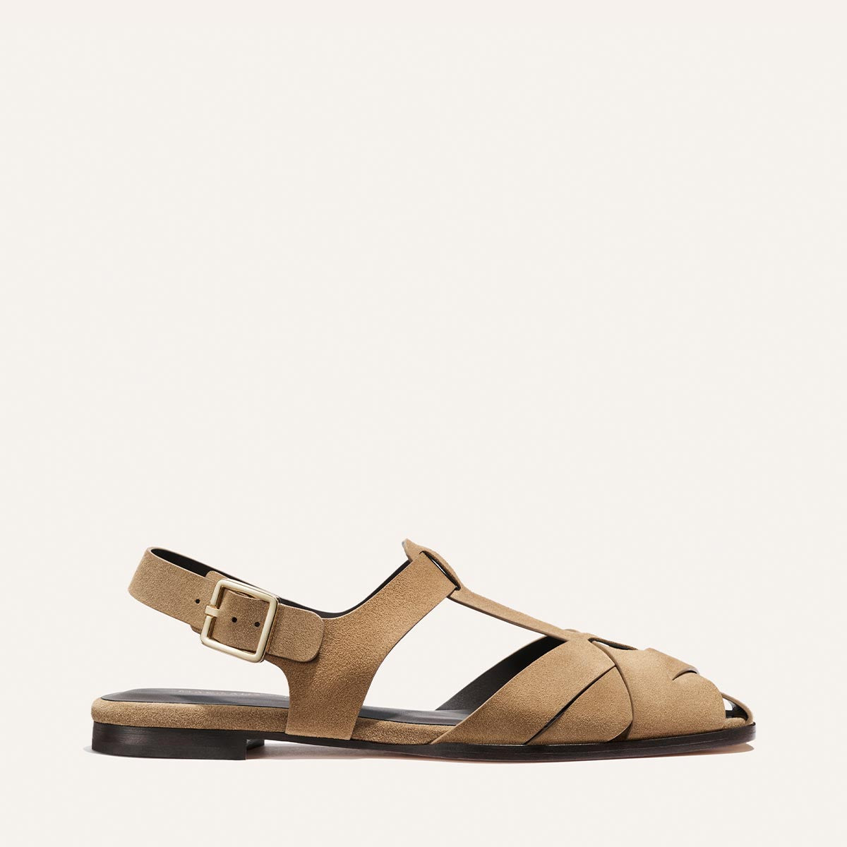 Tan sandal with a strap on a white background