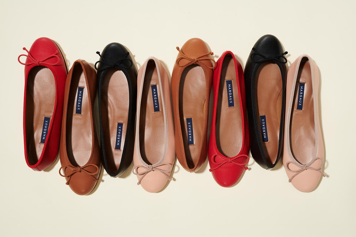 Margaux's bestselling Demi, a classic ballet flat with a rounded toe and bow detail shown in Scarlet, Saddle, Black and Ballet Pink