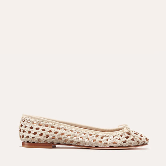 The Demi - Ecru Woven Leather by margaux-development is a handmade beige and brown ballet flat with a bow and flat sole, crafted in Spain and shown on a light background.