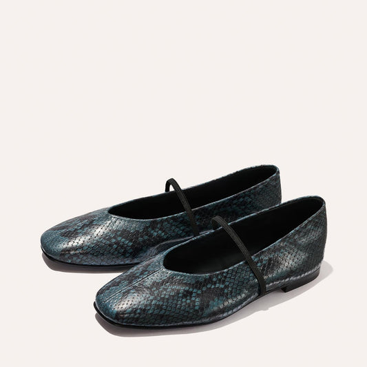 The Phoebe - Aqua Python Embossed by Margaux: flat ballet shoes featuring a dark teal and black snakeskin pattern with a slim black strap across the top, shown on a light background.