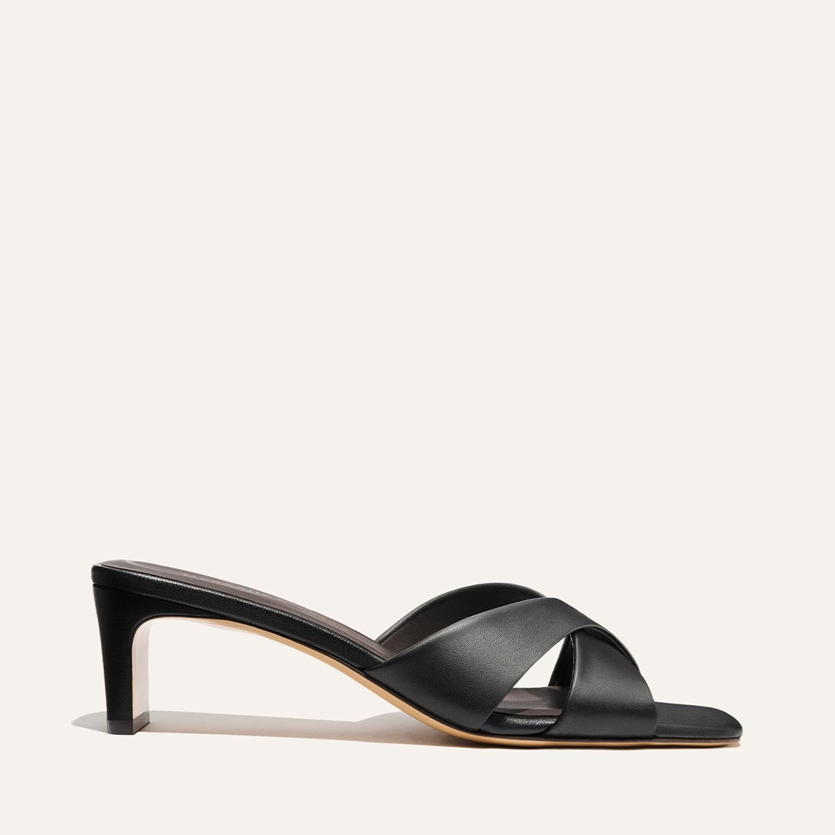 Black heeled sandal on a white background